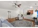 Bright living room features hardwood floors, ceiling fan, opens to the kitchen and dining at 1042 Steelechase Ln, Hanahan, SC 29410