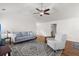 Cozy living room featuring hardwood floors, a modern ceiling fan, and comfortable seating at 1042 Steelechase Ln, Hanahan, SC 29410