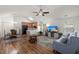 Bright living room with vaulted ceilings, ceiling fan, hardwood floors, and neutral decor at 1042 Steelechase Ln, Hanahan, SC 29410