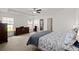 Bright main bedroom with tray ceiling, plush carpet, and natural light at 1042 Steelechase Ln, Hanahan, SC 29410