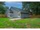 Fenced backyard with well-maintained lawn and patio, perfect for outdoor activities at 105 Glebe Rd, Summerville, SC 29485