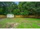 Expansive fenced backyard featuring a storage shed at 105 Glebe Rd, Summerville, SC 29485