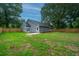 Large, fenced backyard featuring well-maintained lawn and patio at 105 Glebe Rd, Summerville, SC 29485