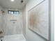 Modern bathroom features a bathtub, shower, and a decorative niche, blending functionality with style at 105 Glebe Rd, Summerville, SC 29485