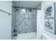 Tastefully updated bathroom features tiled tub surround, niche, and updated fixtures at 105 Glebe Rd, Summerville, SC 29485