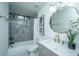Updated bathroom featuring modern vanity, framed mirror, and tub with tiled surround at 105 Glebe Rd, Summerville, SC 29485
