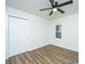 Bright bedroom featuring a ceiling fan, hardwood floors, a window, and a closet at 105 Glebe Rd, Summerville, SC 29485