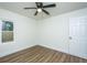 Bright bedroom featuring a ceiling fan, hardwood floors, a window, and a closet at 105 Glebe Rd, Summerville, SC 29485