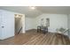 Bonus room featuring hardwood floors, a window, a table and chairs, and a seating area at 105 Glebe Rd, Summerville, SC 29485