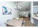 Open concept dining room featuring new hardwood floors, modern lighting and adjoins the living area at 105 Glebe Rd, Summerville, SC 29485