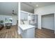Modern kitchen with gray cabinets, white countertop, and open layout into the living area with nice flooring at 105 Glebe Rd, Summerville, SC 29485