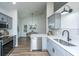 Contemporary kitchen featuring stainless steel appliances, gray cabinets, and open dining space with lots of natural light at 105 Glebe Rd, Summerville, SC 29485