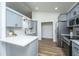 Contemporary kitchen with stainless steel appliances, quartz countertops, and gray shaker cabinets at 105 Glebe Rd, Summerville, SC 29485