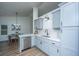 Modern kitchen featuring gray cabinets, white countertops, stainless steel appliances, and stylish backsplash at 105 Glebe Rd, Summerville, SC 29485
