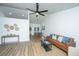 Bright and airy living room features a neutral palette and wood floors at 105 Glebe Rd, Summerville, SC 29485