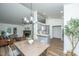 Open concept living, dining, and kitchen area, with modern decor, light colors and vaulted ceilings at 105 Glebe Rd, Summerville, SC 29485