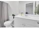 Clean bathroom showcasing a white vanity, toilet, shower with gray curtain, and mirror at 105 Oast Ln, Summerville, SC 29485