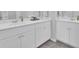 Double sink bathroom vanity with white cabinets and solid surface countertops at 105 Oast Ln, Summerville, SC 29485
