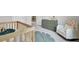 Cozy Bedroom showcases a wooden crib, green dresser, and comfortable armchair on neutral carpet at 105 Oast Ln, Summerville, SC 29485