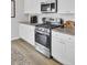 Close-up of a modern kitchen with stainless steel appliances and granite countertops at 105 Oast Ln, Summerville, SC 29485