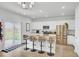 Modern kitchen with an island, bar stools, stainless steel appliances, and wood flooring at 105 Oast Ln, Summerville, SC 29485