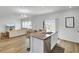 Stylish kitchen island with seating, stainless steel appliances, granite countertops, and open layout to the living room at 105 Oast Ln, Summerville, SC 29485
