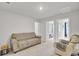 Inviting living room featuring neutral walls, carpet, and a seating area at 105 Oast Ln, Summerville, SC 29485