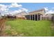 Large backyard with green lawn and screened porch at 111 Nolin Road Rd, Moncks Corner, SC 29461