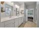 Bathroom with double vanity sinks and a doorway leading to a bedroom at 111 Nolin Road Rd, Moncks Corner, SC 29461