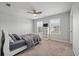 Bright bedroom features a ceiling fan and windows overlooking the yard at 111 Nolin Road Rd, Moncks Corner, SC 29461