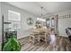 Dining room with natural light, table set for four, and sliding door to outdoor space at 111 Nolin Road Rd, Moncks Corner, SC 29461
