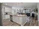 Spacious kitchen with a large island, granite countertops, stainless steel appliances, open to the living area at 111 Nolin Road Rd, Moncks Corner, SC 29461