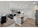 Open kitchen flows into living area; features stainless appliances, granite counters, and island with breakfast bar at 111 Nolin Road Rd, Moncks Corner, SC 29461