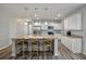 Bright kitchen with white cabinets, stainless steel appliances, and a large island with seating at 111 Nolin Road Rd, Moncks Corner, SC 29461