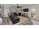 Comfortable living room features a decorative fireplace, and hardwood floors at 111 Nolin Road Rd, Moncks Corner, SC 29461