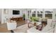 Bright living room with stylish furnishings, large windows, and a sliding glass door at 122 Lefton Lndg, Summerville, SC 29485
