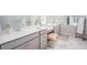 Elegant bathroom with dual vanities, marble countertops, a makeup vanity, and a luxurious marble floor at 124 Maritime Way, Summerville, SC 29485