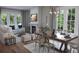 Dining room with fireplace, modern decor, large windows, and plenty of seating at 124 Maritime Way, Summerville, SC 29485