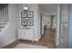 Inviting foyer with wood floors, stylish decor, and open view to the home's main living areas at 124 Maritime Way, Summerville, SC 29485