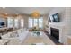 Spacious living room featuring a fireplace, modern decor, and an open floor plan leading to the kitchen at 124 Maritime Way, Summerville, SC 29485