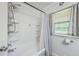 This bathroom features a shower and a large window for natural light at 1314 Cooper Store Rd, Moncks Corner, SC 29461