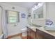 This bathroom includes granite countertops, a stylish sink, and a large mirror at 1314 Cooper Store Rd, Moncks Corner, SC 29461