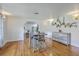 Inviting dining space with hardwood floors and stylish display shelves at 1314 Cooper Store Rd, Moncks Corner, SC 29461