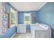 This laundry room has a washer, a dryer, and a large window at 1314 Cooper Store Rd, Moncks Corner, SC 29461