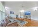 Cozy living room with hardwood floors, comfortable seating, and modern entertainment center at 1314 Cooper Store Rd, Moncks Corner, SC 29461