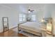 This primary bedroom includes hardwood flooring and a large window at 1314 Cooper Store Rd, Moncks Corner, SC 29461
