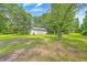 Wide view of the back yard with a large metal storage building at 1314 Cooper Store Rd, Moncks Corner, SC 29461