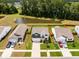 Aerial view showcasing a home near a serene pond and lush green trees at 141 Pine Crest View Dr, Summerville, SC 29486