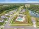 Beautiful aerial view of community pool, lush landscaping and homes surrounding a tranquil lake at 141 Pine Crest View Dr, Summerville, SC 29486