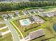 Overhead shot of a neighborhood featuring a community pool with cabana and beautiful landscaping at 141 Pine Crest View Dr, Summerville, SC 29486